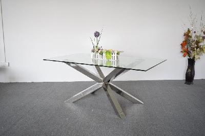 dining table in crisscross shaped high glossy stainless steel base with 12mm tempered glass top