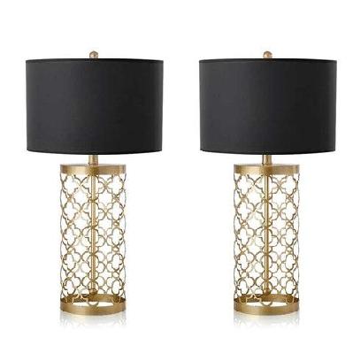 2x golden hollowed out base table lamp with dark shade