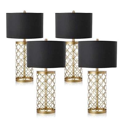4x golden hollowed out base table lamp with dark shade
