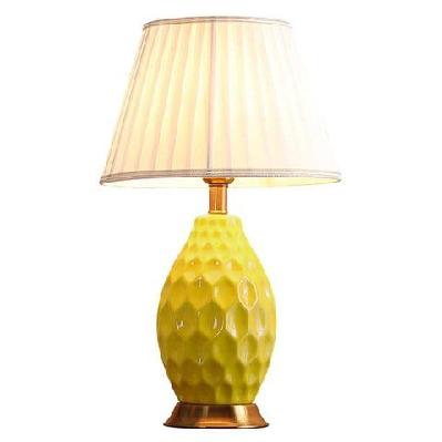 textured ceramic oval table lamp with gold metal base yellow